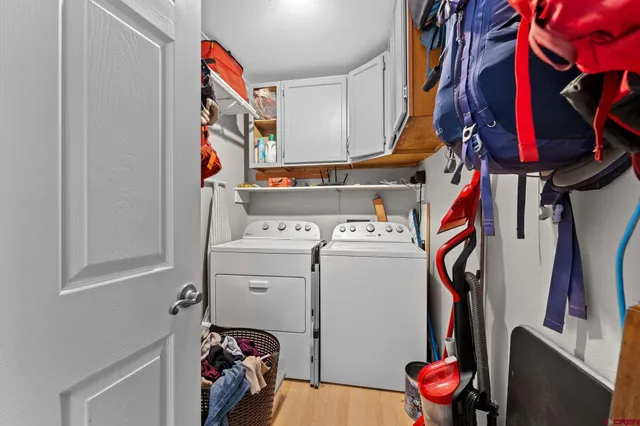 a bedroom with a bed a desk and chair