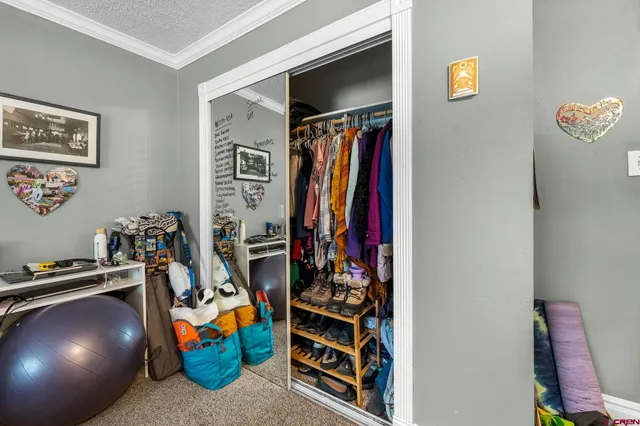 a bedroom with furniture and a window