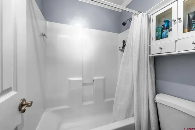 a view of a two chairs in the balcony