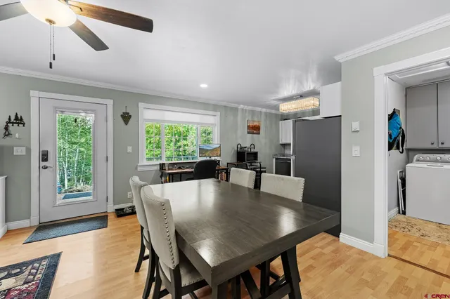 a dining room with furniture and window