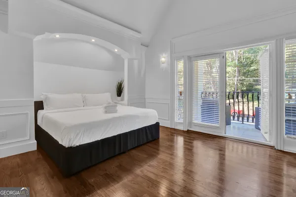 a large white bed in a white room