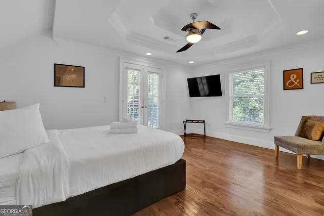 a view of entryway and hall with wooden floor