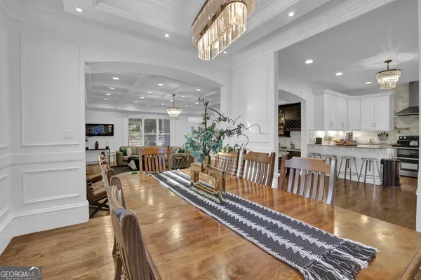 a kitchen with stainless steel appliances kitchen island granite countertop a sink cabinets and microwave
