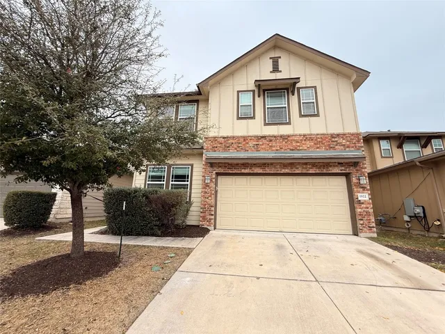 a kitchen with granite countertop stainless steel appliances and wooden cabinets