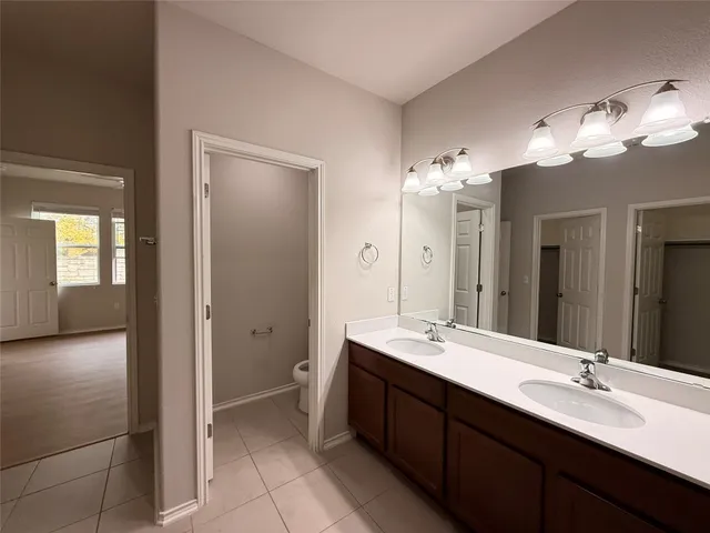 a bathroom with a glass shower door