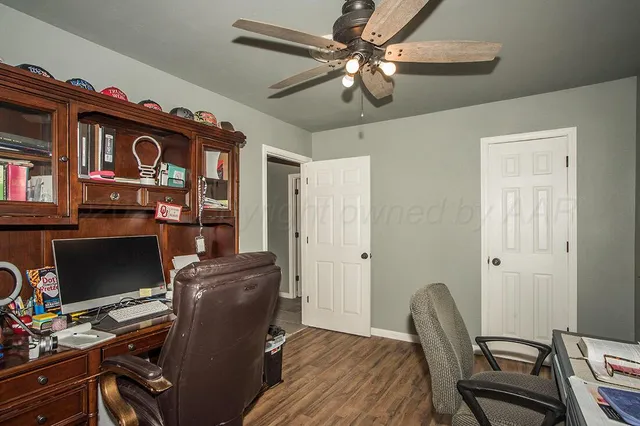 a workspace with furniture and wooden floor