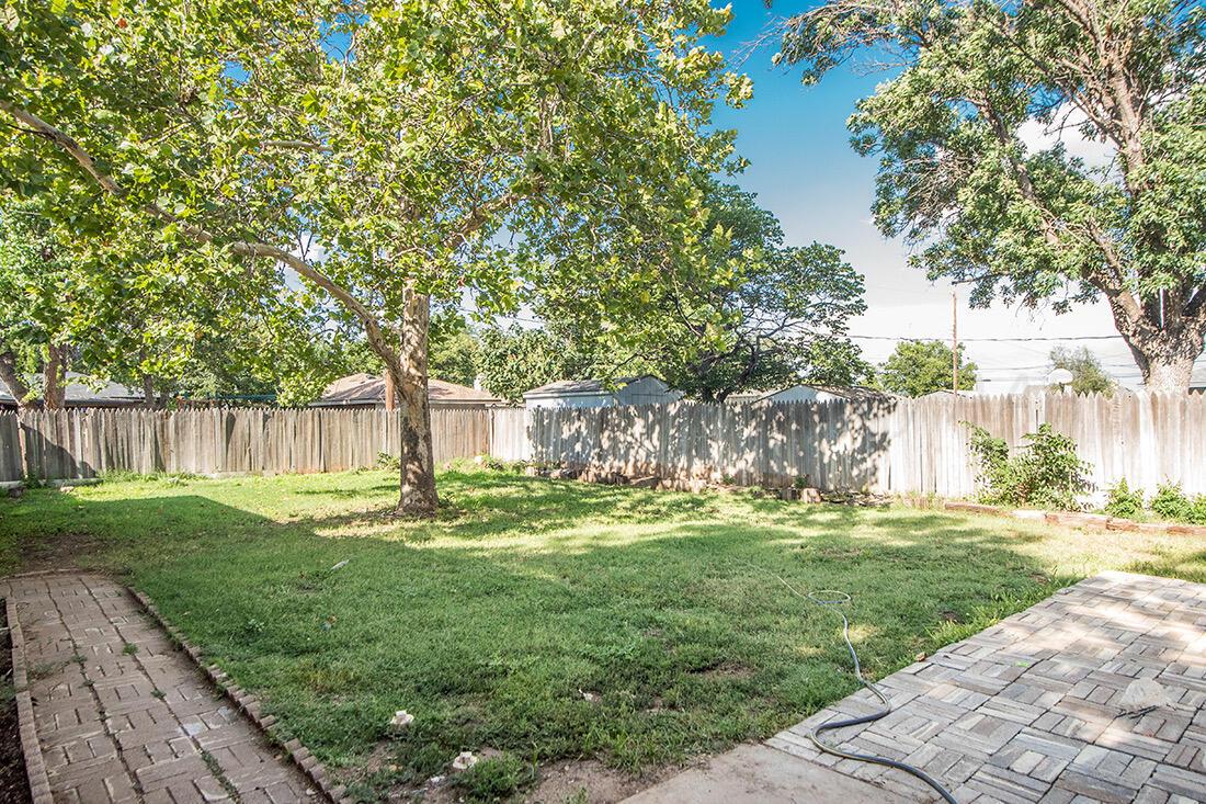 4206 Arden Road Amarillo, TX 79110 - Photo 21 of 24 a garden with trees in front of it