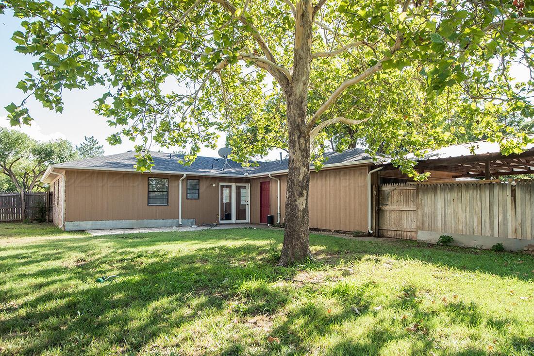 4206 Arden Road Amarillo, TX 79110 - Photo 23 of 24 a view of a house with a yard and large tree
