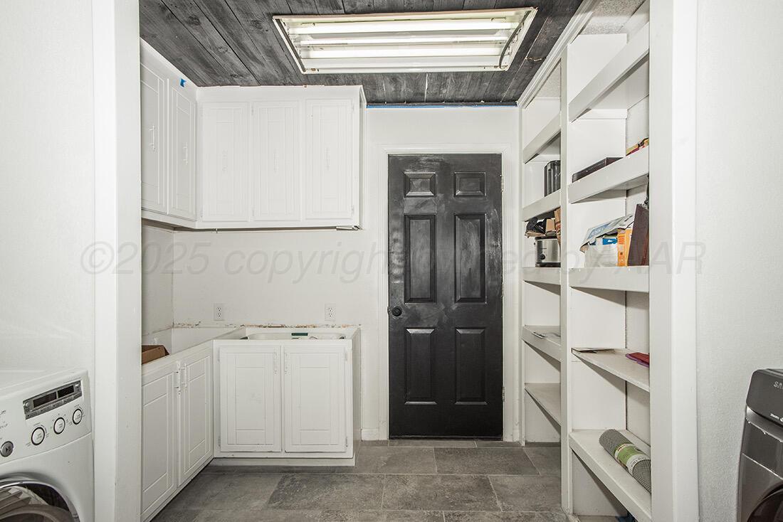 4206 Arden Road Amarillo, TX 79110 - Photo 4 of 24 a view of walk in closet with clothes and shoes