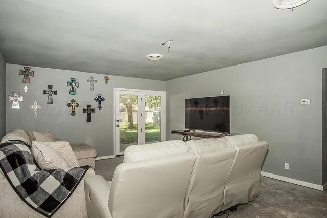 a bedroom with bed and window