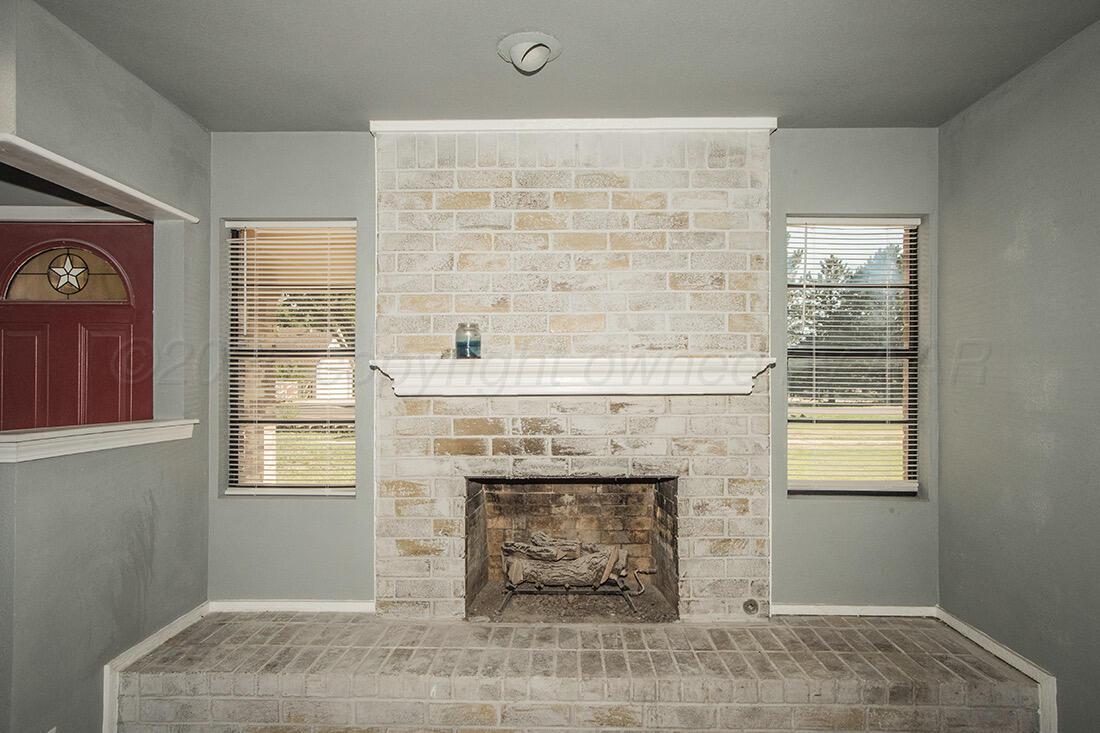 4206 Arden Road Amarillo, TX 79110 - Photo 7 of 24 a room with a fireplace