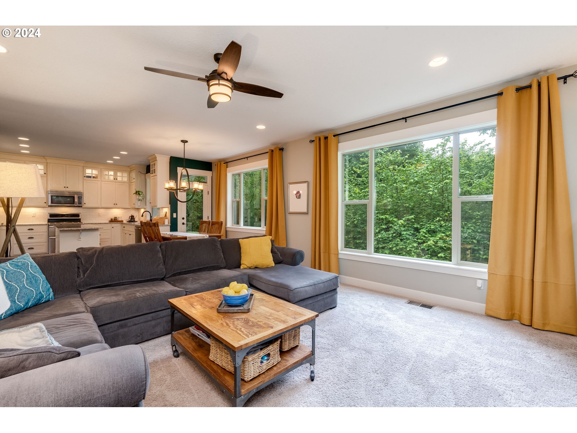 15057 Southeast Glenbrook Road Happy Valley, OR 97015 - Photo 16 of 43 a living room with furniture and a large window