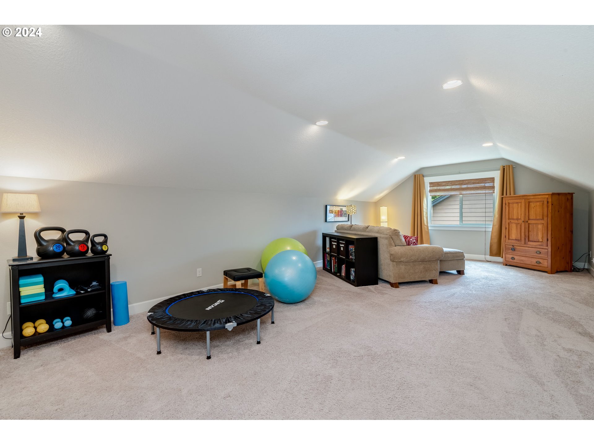 15057 Southeast Glenbrook Road Happy Valley, OR 97015 - Photo 30 of 43 a living room with furniture and gym equipment