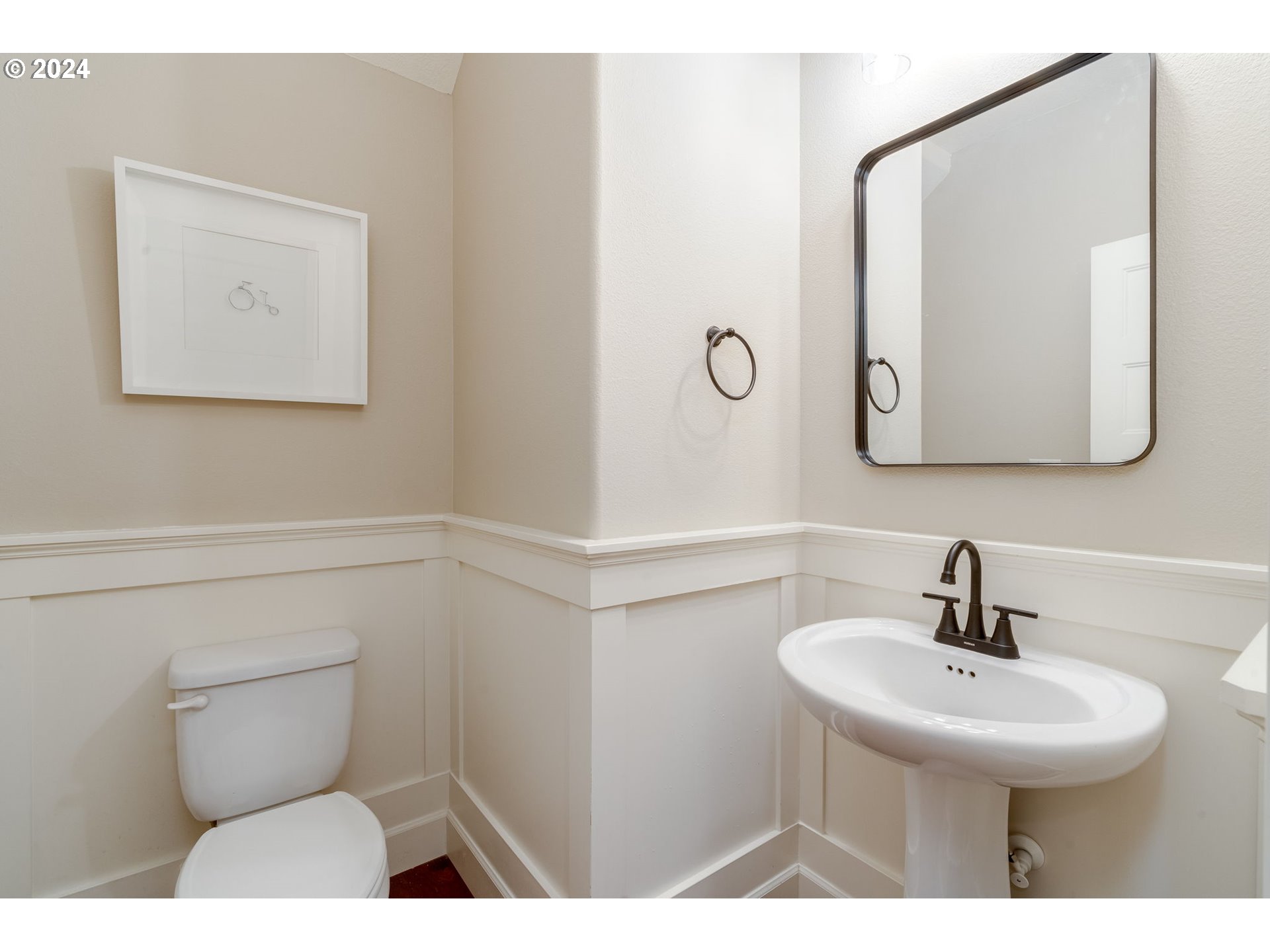 15057 Southeast Glenbrook Road Happy Valley, OR 97015 - Photo 31 of 43 a bathroom with a toilet sink and mirror