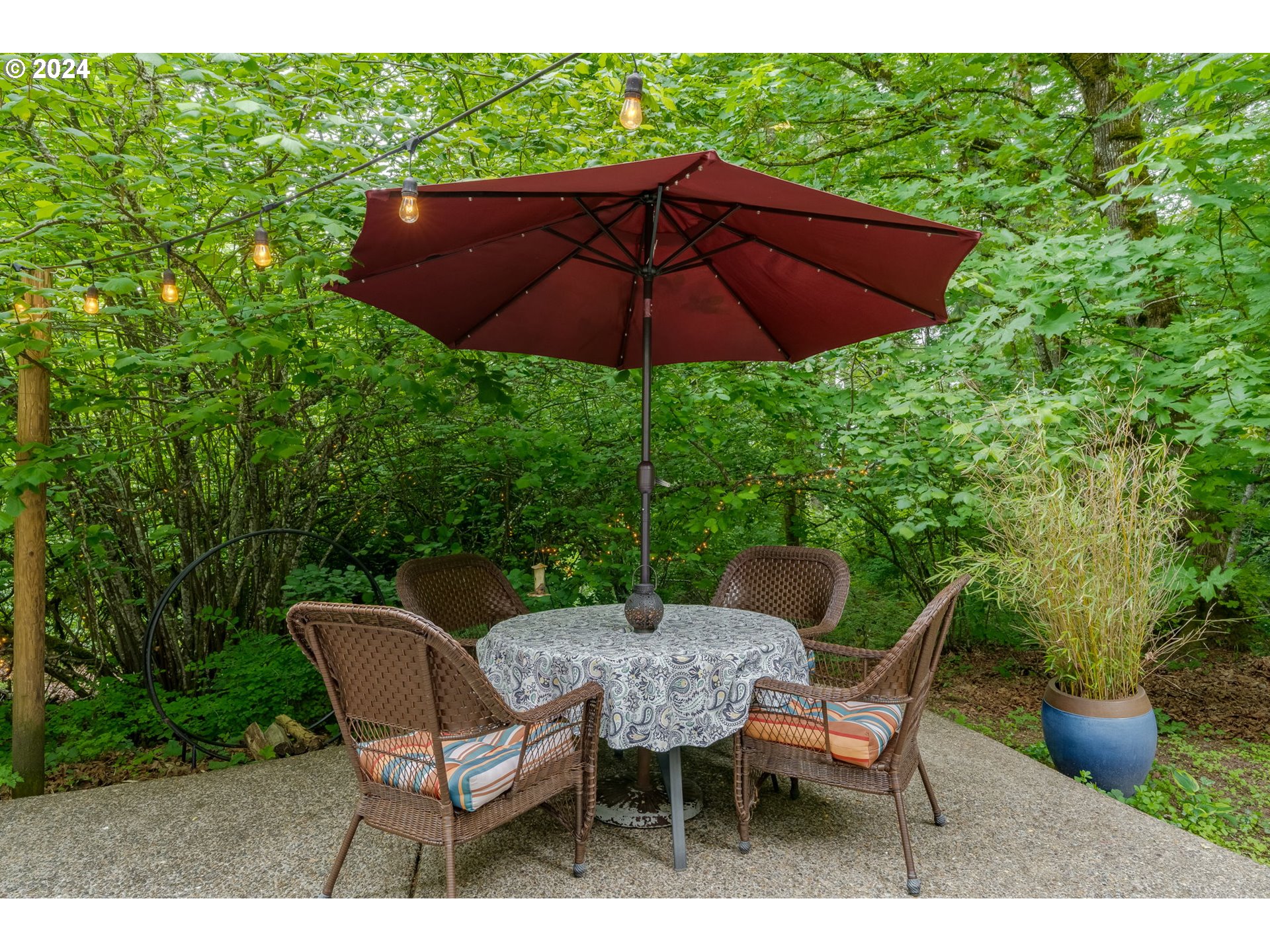 15057 Southeast Glenbrook Road Happy Valley, OR 97015 - Photo 32 of 43 a view of an outdoor sitting area with furniture and umbrella