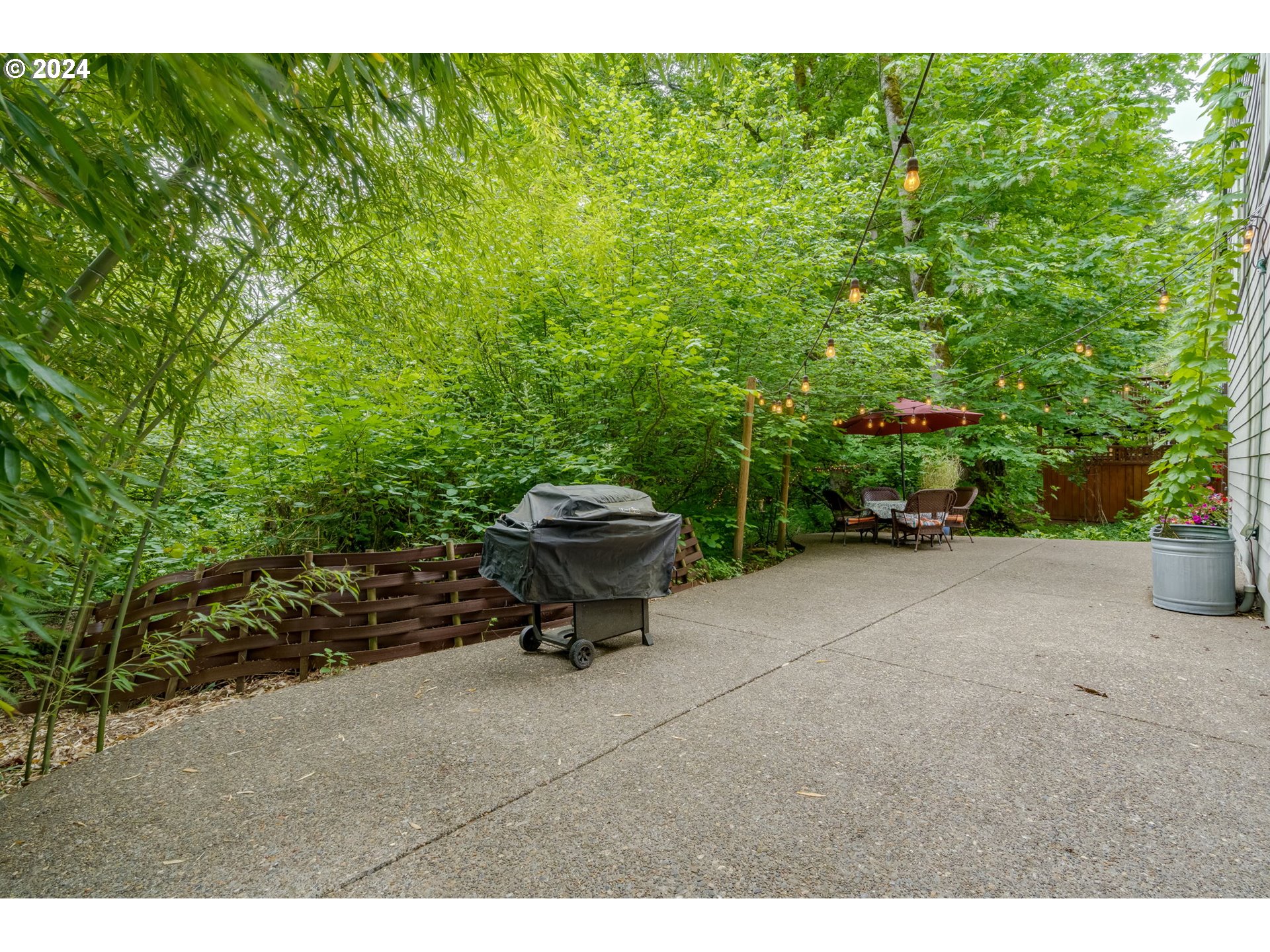 15057 Southeast Glenbrook Road Happy Valley, OR 97015 - Photo 34 of 43 a garden view with a seating space