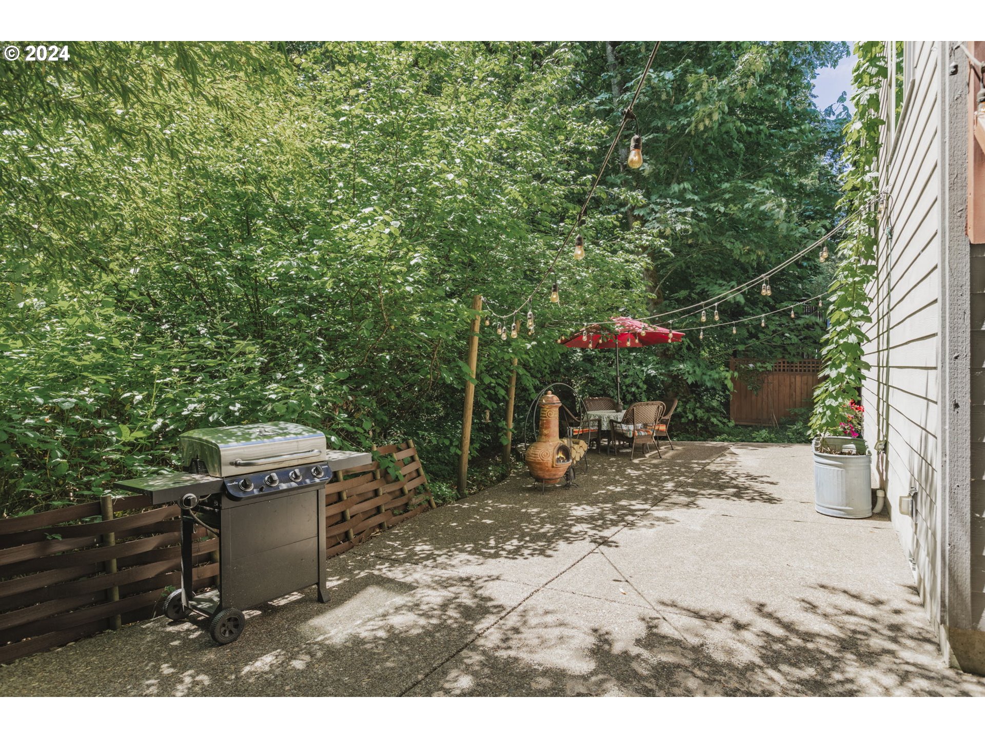 15057 Southeast Glenbrook Road Happy Valley, OR 97015 - Photo 39 of 43 a view of a backyard with sitting area