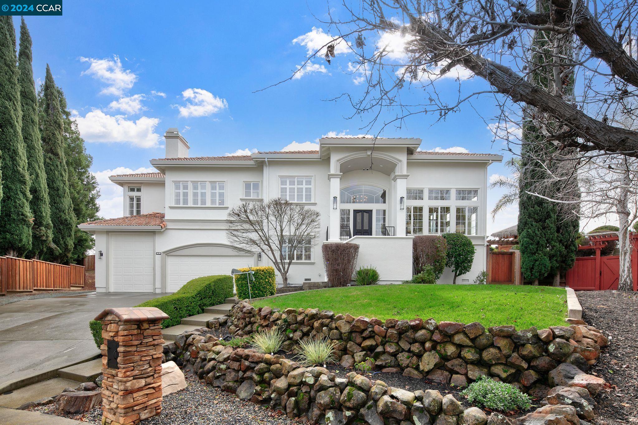 a view of a house with a garden