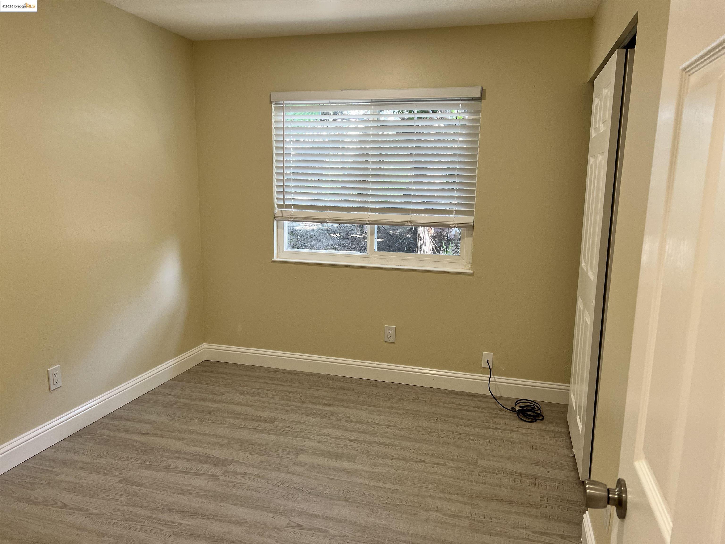 162 Riverside Drive Bay Point, CA 94565 - Photo 15 of 16 a view of a room with wooden floor and a window