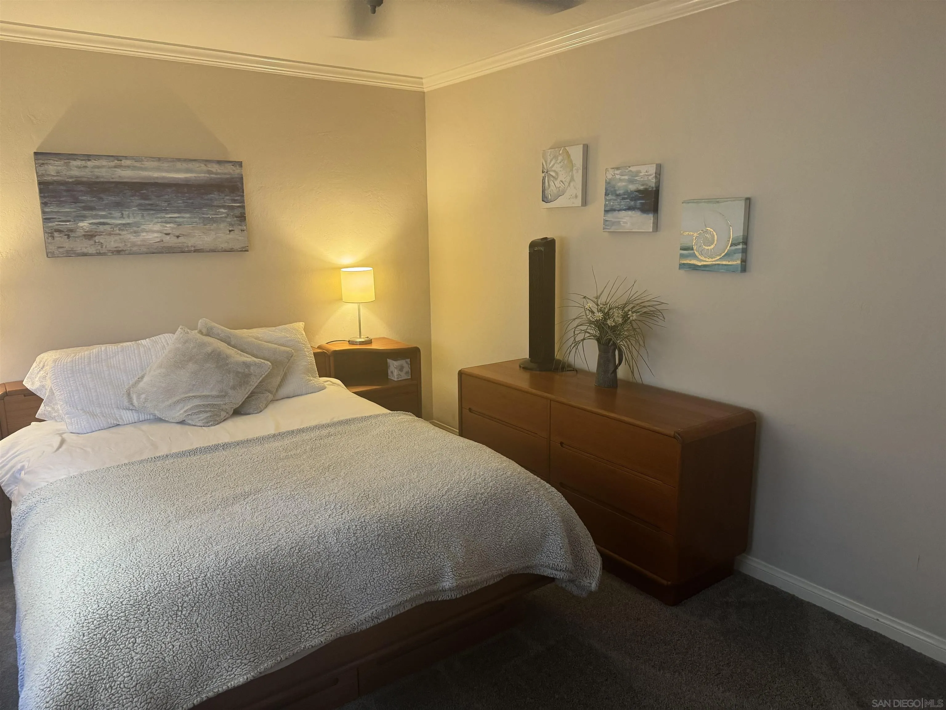 215 Bonair Street, Unit 8 La Jolla, CA 92037 - Photo 12 of 17 a bedroom with a bed and painting on the wall