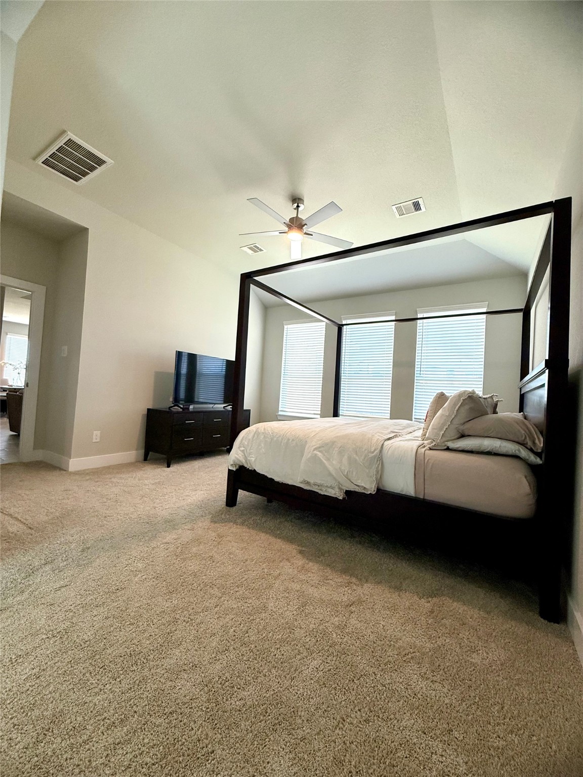 408 Hampton Edge Lane Waller, TX 77484 - Photo 13 of 16 a bedroom with a bed and a chair