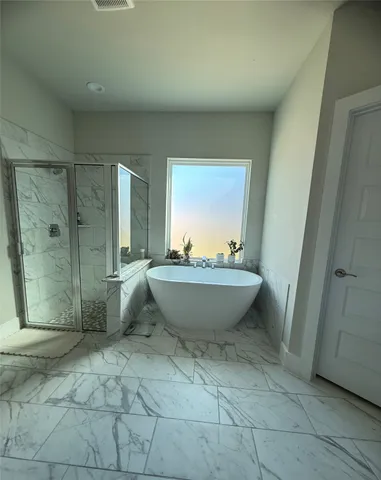 a view of a bathtub in bathroom