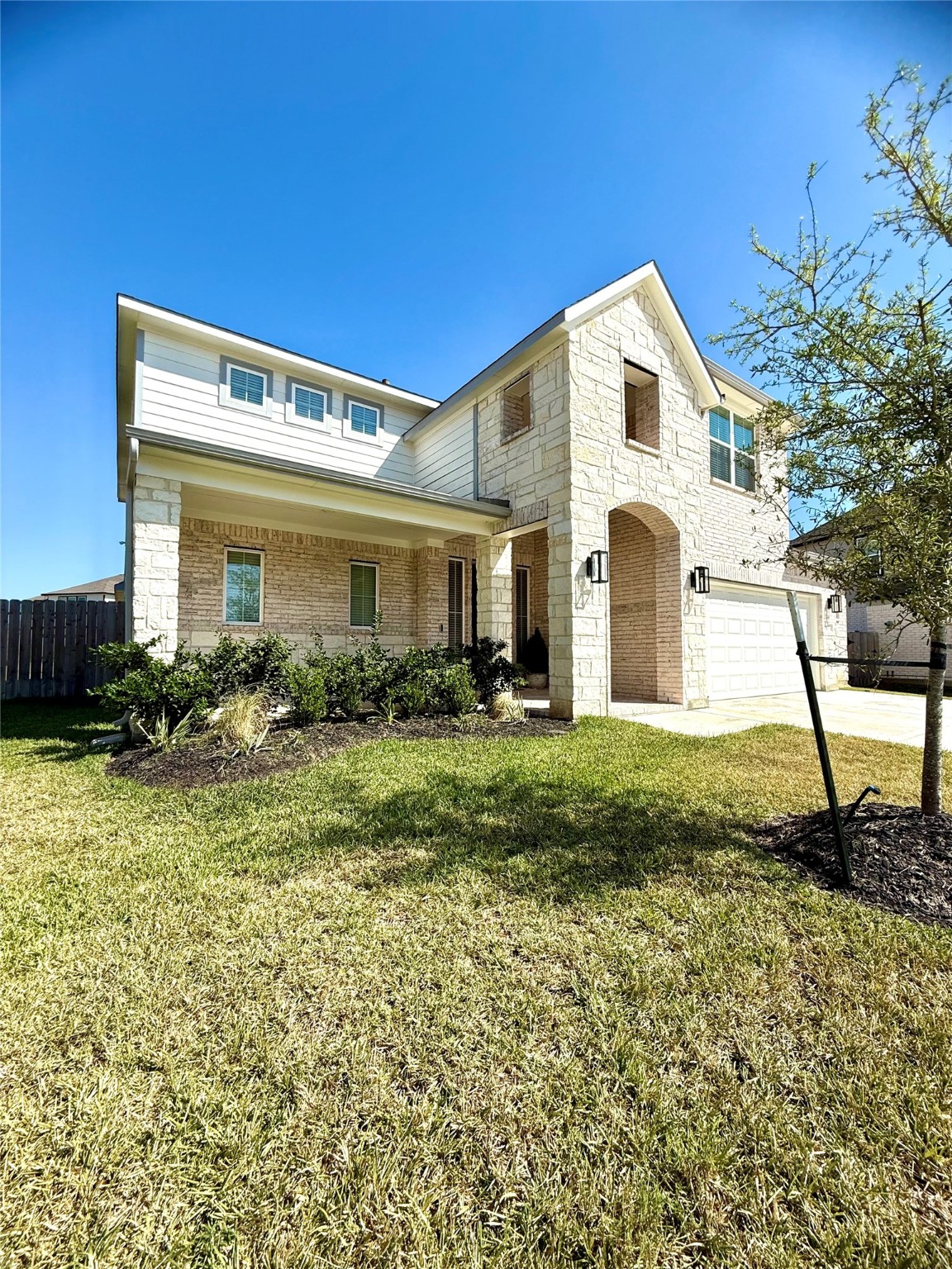 408 Hampton Edge Lane Waller, TX 77484 - Photo 2 of 16 a front view of a house with a yard
