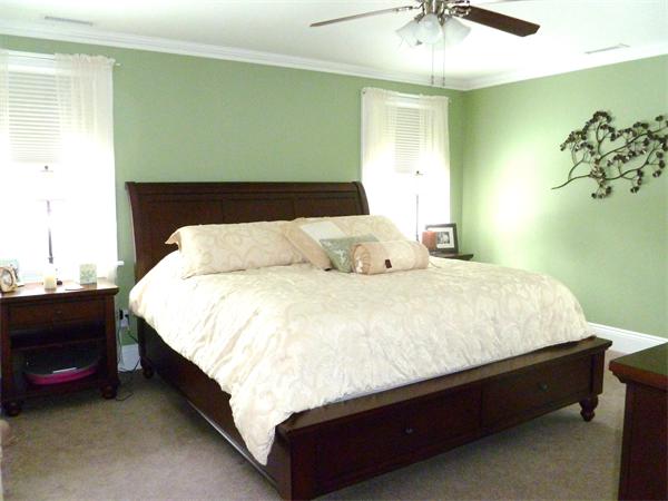 59 Gilman Road Waltham, MA 02452 - Photo 14 of 30 a large bed sitting in a bedroom next to a window