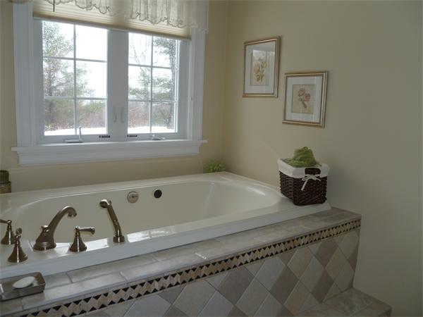 59 Gilman Road Waltham, MA 02452 - Photo 16 of 30 a bath tub sitting next to a window