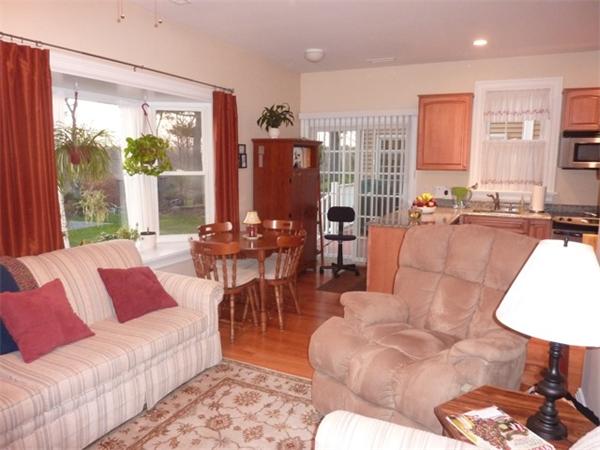 59 Gilman Road Waltham, MA 02452 - Photo 23 of 30 a living room with furniture and a large window