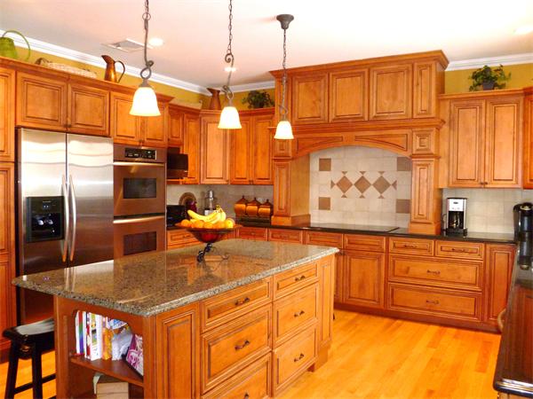 59 Gilman Road Waltham, MA 02452 - Photo 6 of 30 a kitchen with stainless steel appliances granite countertop a sink a stove and a refrigerator