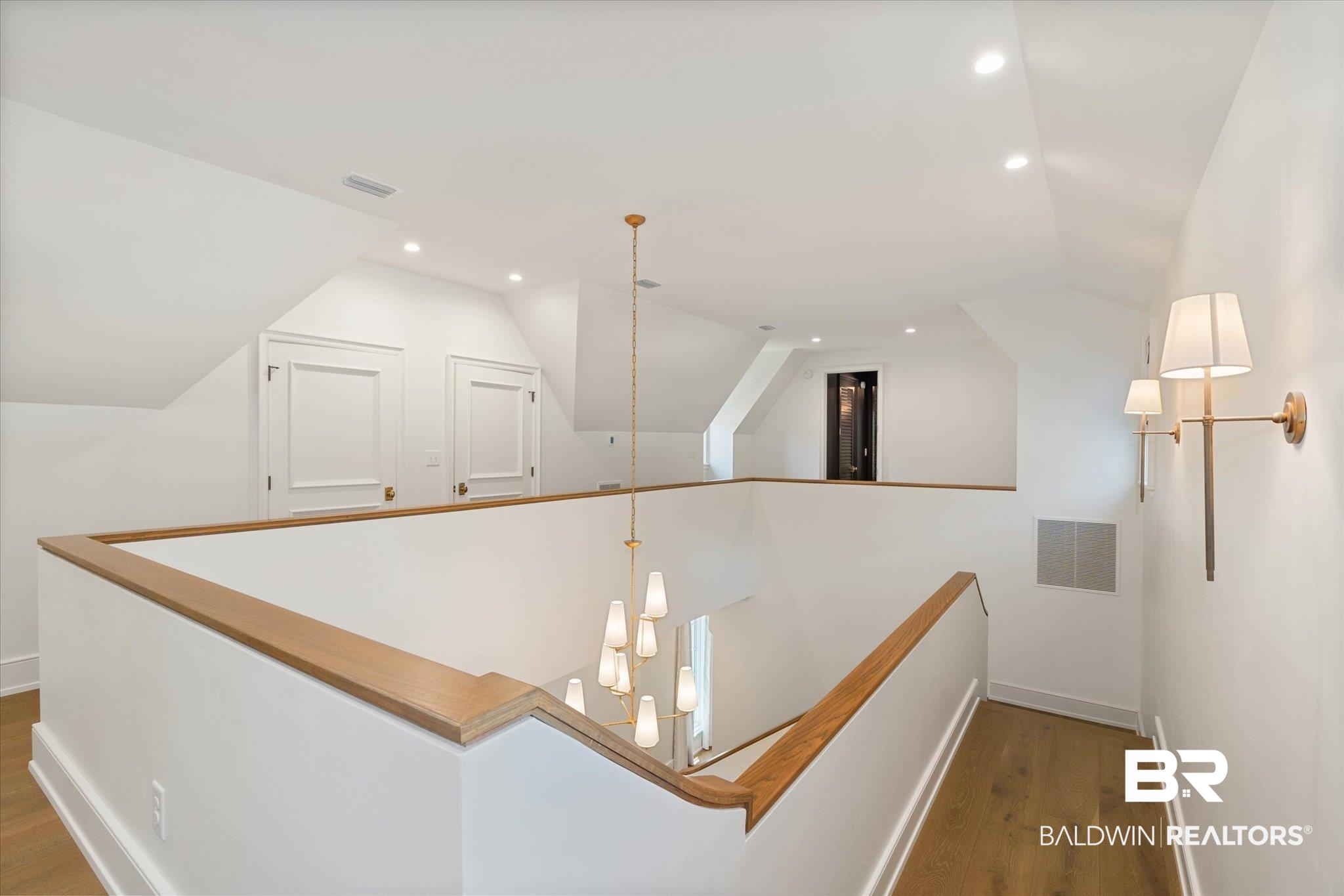 3 Canterbury Park Mobile, AL 36608 - Photo 25 of 43 Hall with an upstairs landing, wood finished floors, baseboards, vaulted ceiling, and recessed lighting