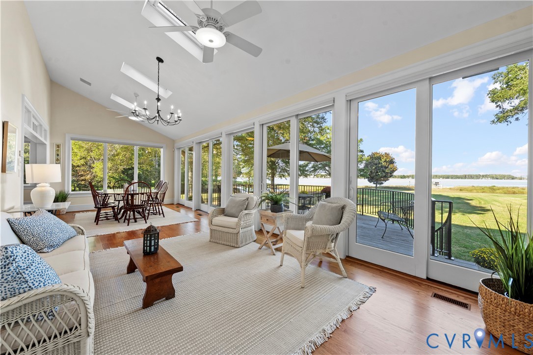 2515 Fleet's Bay Road White Stone, VA 22578 - Photo 8 of 74 a living room with patio furniture and a floor to ceiling window