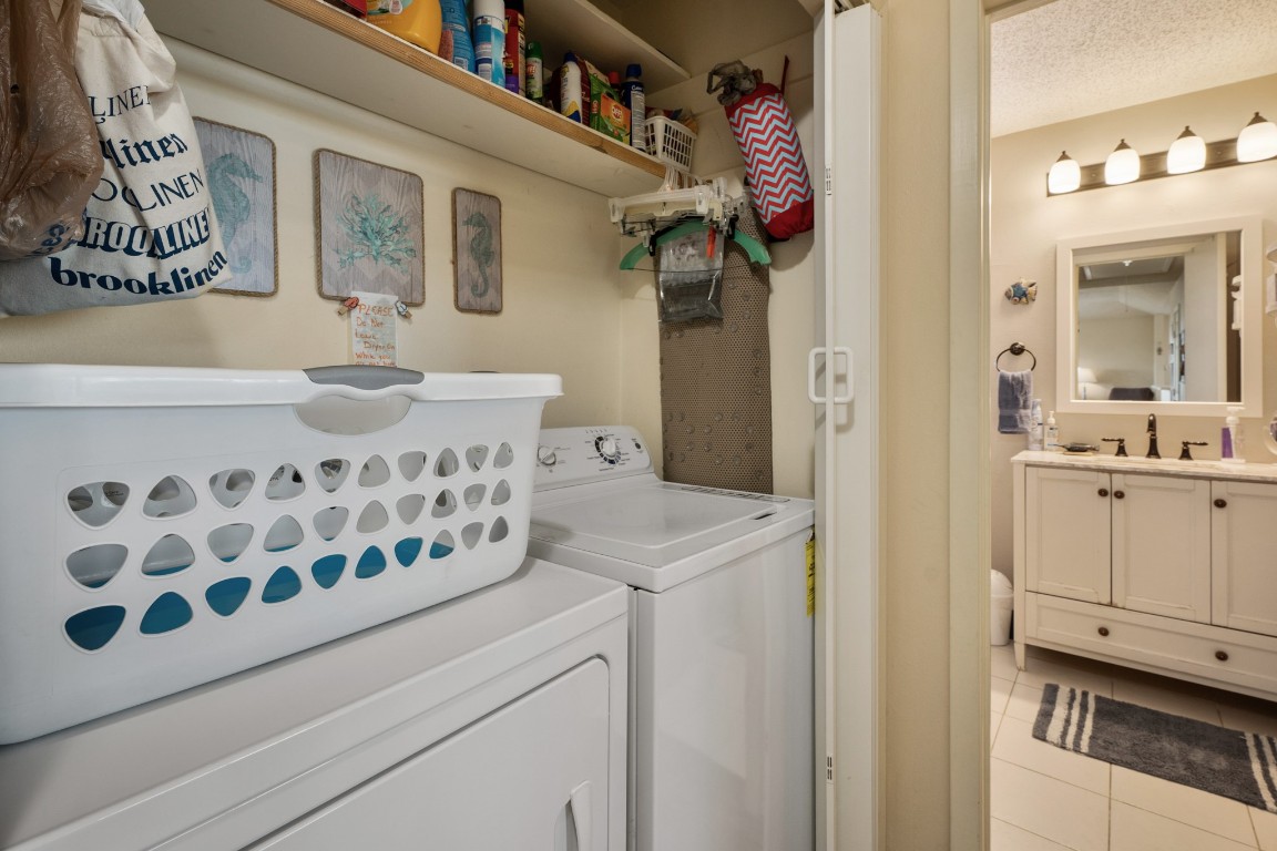 16507 Captain Kidd Road Jamaica Beach, TX 77554 - Photo 27 of 37 Laundry room in the house with shelving and storage.