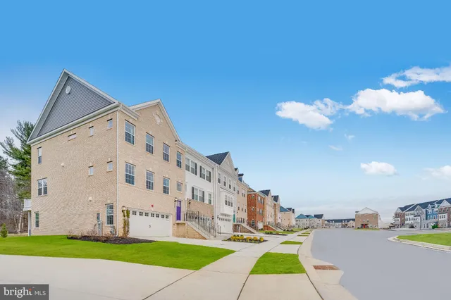 a view of building with yard in front of it