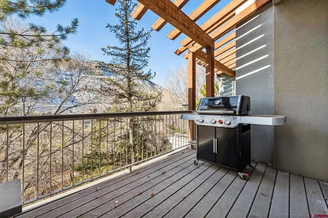 a view of balcony and deck with wooden floor