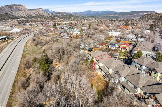 an aerial view of residential house with parking space