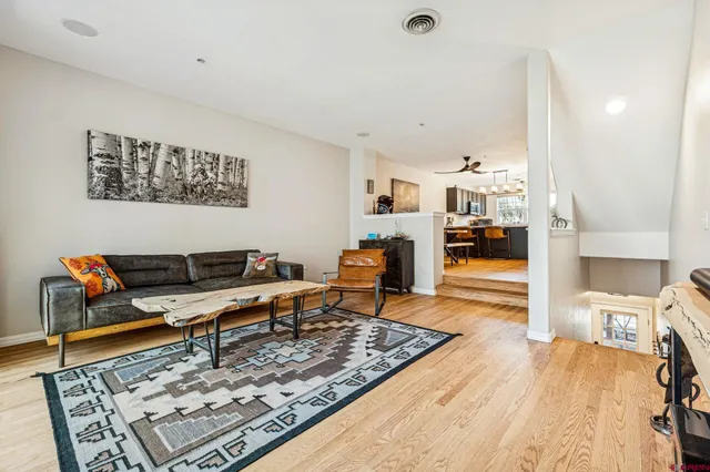a living room with furniture and a rug