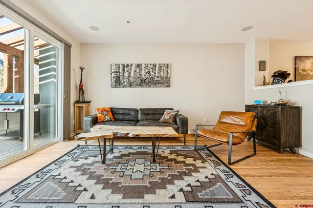 a living room with furniture and a rug
