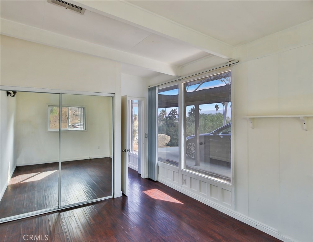 3060 Panorama Road Riverside, CA 92506 - Photo 27 of 38 an empty room with wooden floor and windows