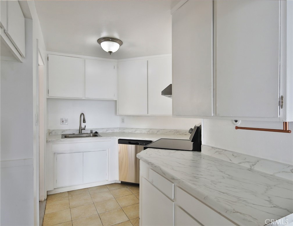 3060 Panorama Road Riverside, CA 92506 - Photo 29 of 38 a kitchen with a sink stove and cabinets