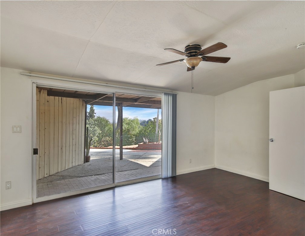 3060 Panorama Road Riverside, CA 92506 - Photo 30 of 38 a view of a livingroom with a ceiling fan and hardwood floor
