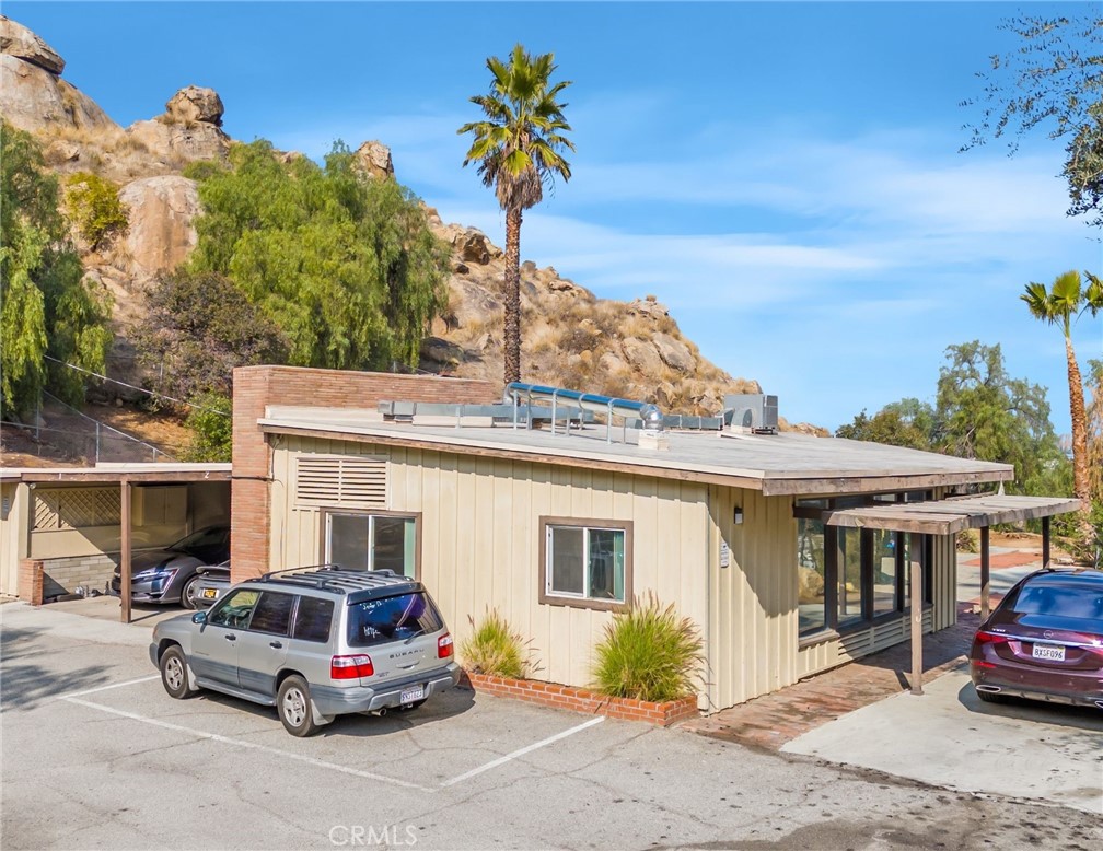 3060 Panorama Road Riverside, CA 92506 - Photo 37 of 38 a car parked in front of a white house