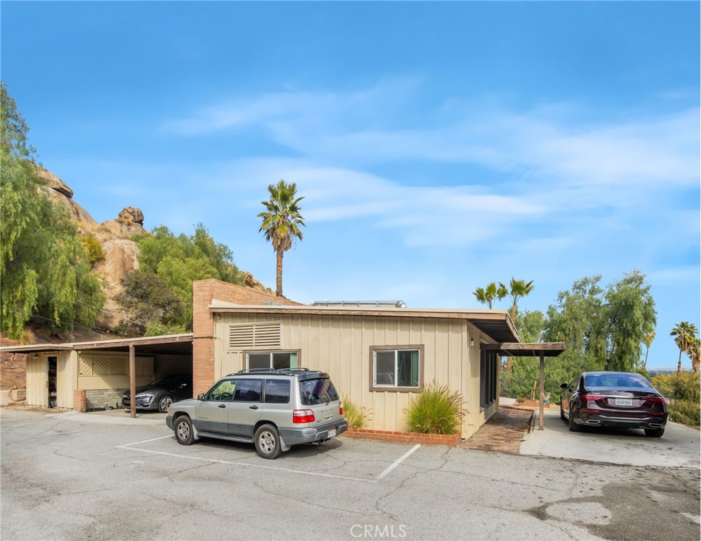 3060 Panorama Road Riverside, CA 92506 - Photo 7 of 38 a car parked in front of a house
