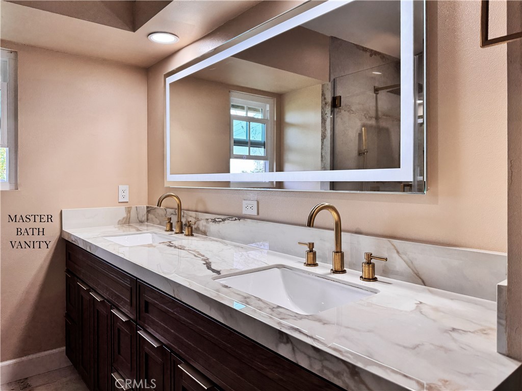 312 Torito Lane Diamond Bar, CA 91765 - Photo 19 of 20 a bathroom with double sink and a mirror