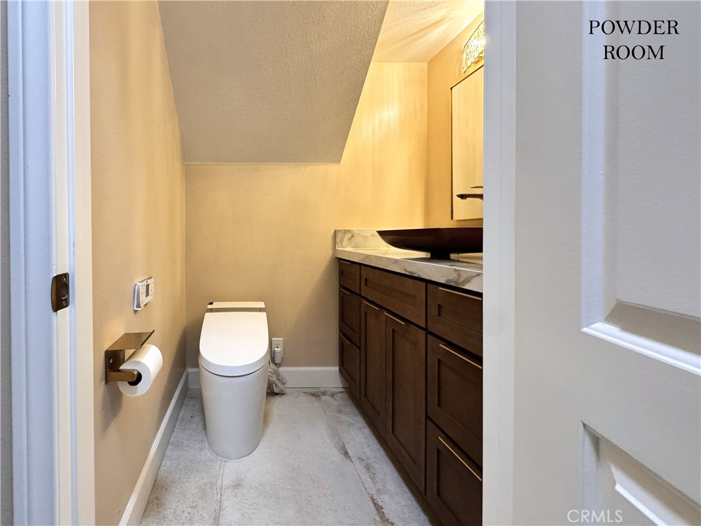 312 Torito Lane Diamond Bar, CA 91765 - Photo 7 of 20 a bathroom with a granite countertop toilet sink and mirror