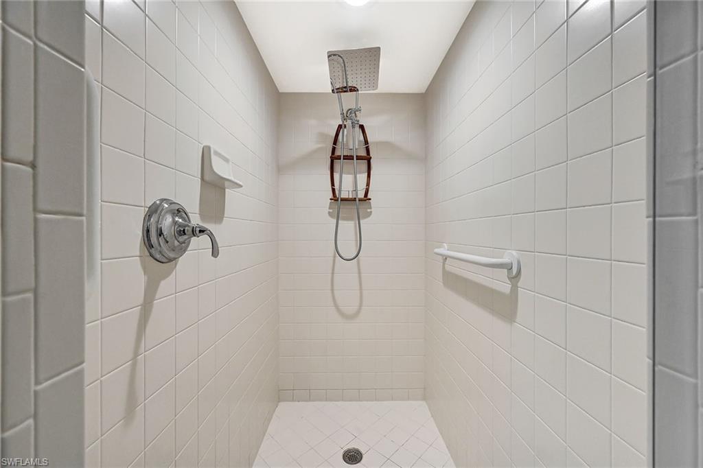 6573 Marissa Loop, Unit 703 Naples, FL 34108 - Photo 22 of 38 Walk-in Shower in Primary Bathroom