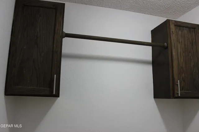 a living room with a fireplace and a wooden floor