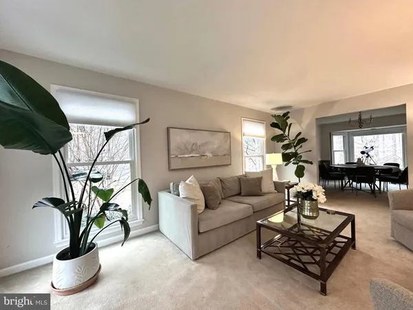 a living room with furniture and flat screen tv