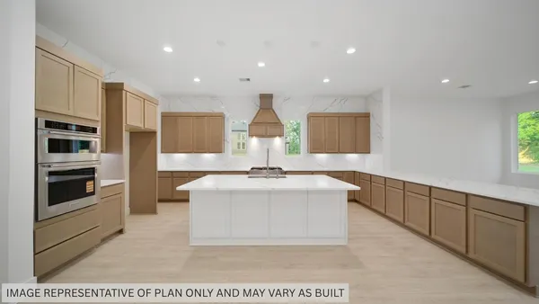 a view of living room with stainless steel appliances granite countertop furniture and a kitchen view